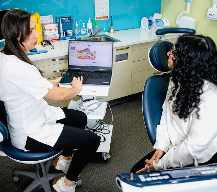 A patient discussing porcelain veneer options during a dental consultation.