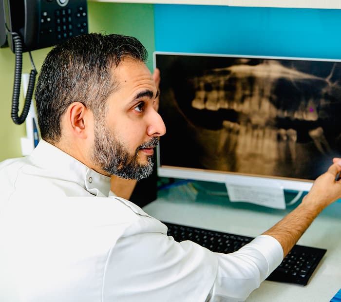 A dental team preparing for a wisdom teeth assessment.